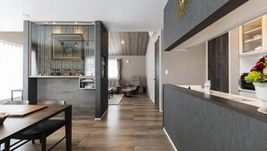 A modern interior with a dining area, kitchen, and living space. - CONTRAIL【Ezo Fuji hoothills】 (Makkari-mura)