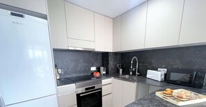 Fridge, microwave, coffee/tea maker, toaster
