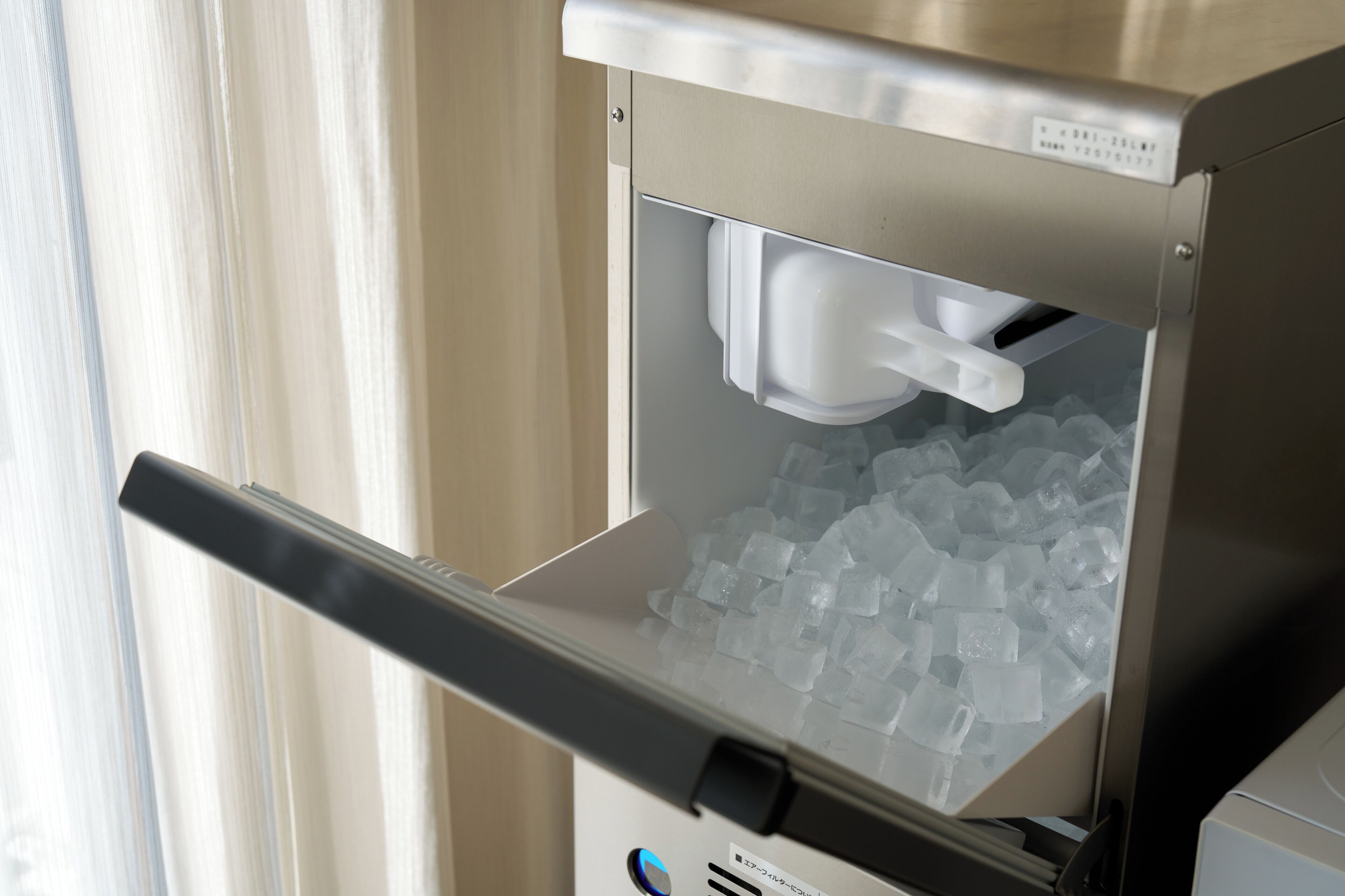 A vending machine with a compartment containing ice cubes.