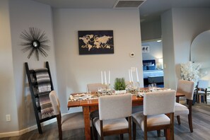 A dining area with a wooden table set for six, surrounded by six chairs. - Bright Star - Hot Tub • Near Sedona & Old Town (Cottonwood)