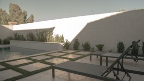 A courtyard with a pool, benches, and a pergola. - Upscale Home - Heated Modern Pool, Outdoor BBQ, Large Kitchen, Up to 8 Guests! (Las Vegas)