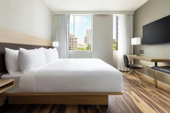 Room, 1 King Bed, City View | In-room safe, desk, laptop workspace, blackout drapes at AC by Marriott Hotel Honolulu