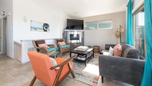 A living room with a sofa, chairs, a coffee table, and a fireplace. - Dog-Friendly Beach Escape - 20% off March stays (Moclips)