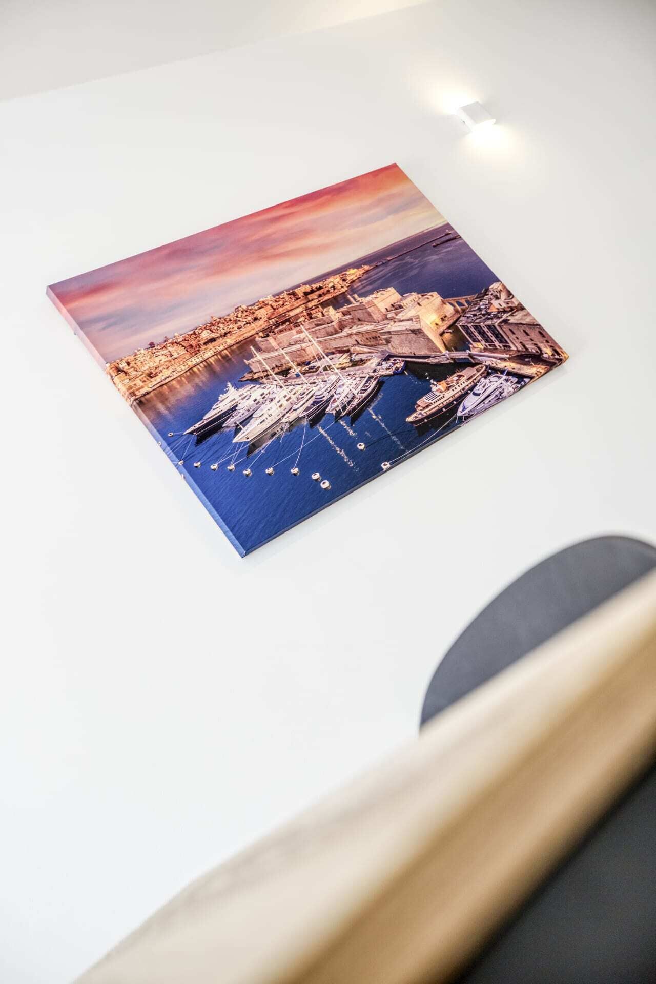 A photograph of a harbor with boats and a cityscape.