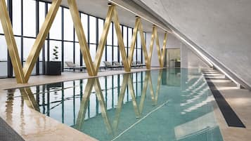 Indoor pool, open 7:00 AM to 10:00 PM, pool umbrellas, pool loungers