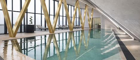 Indoor pool, open 7:00 AM to 10:00 PM, pool umbrellas, pool loungers