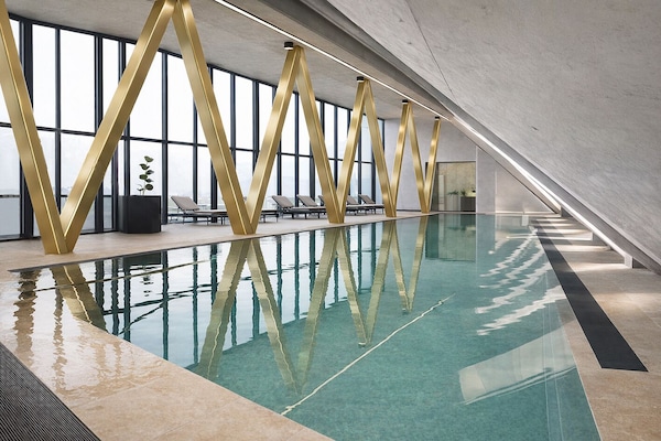 Indoor pool, open 7:00 AM to 10:00 PM, pool umbrellas, sun loungers