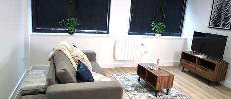 Apartemen, 1 Tempat Tidur Queen dengan tempat tidur Sofa | Area keluarga