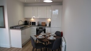 Apartment, 1 Queen Bed with Sofa bed | Private kitchen | Fridge, microwave, oven, stovetop
