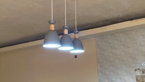 A ceiling with three pendant lights.