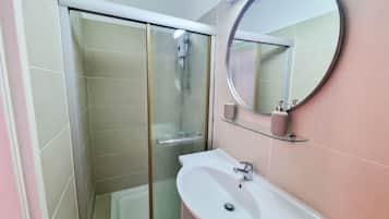 Standard Studio | Bathroom | Shower, towels, toilet paper
