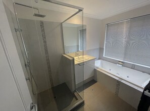 Jetted bath, hair dryer, towels, soap