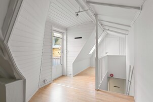 City Apartment | Living area | 50-inch Smart TV with cable channels, heated floors