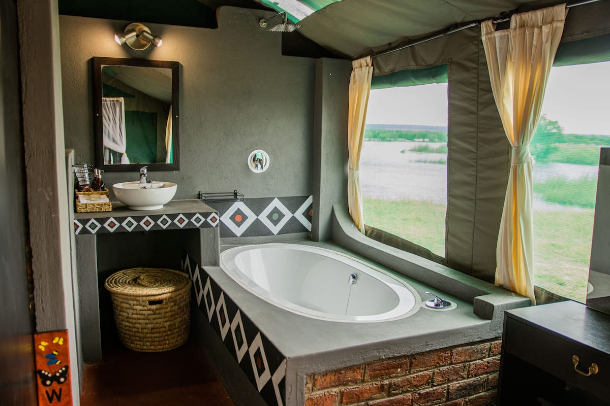 Shower, rainfall showerhead, eco-friendly toiletries, towels