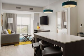 Premium bedding, laptop workspace, blackout curtains, iron/ironing board