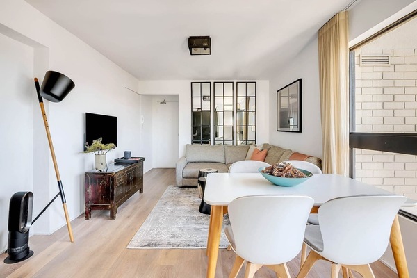 A four-person dining table in the living area allows guests the space to come together for a shared meal. There are also abundant restaurants and eateries nearby.