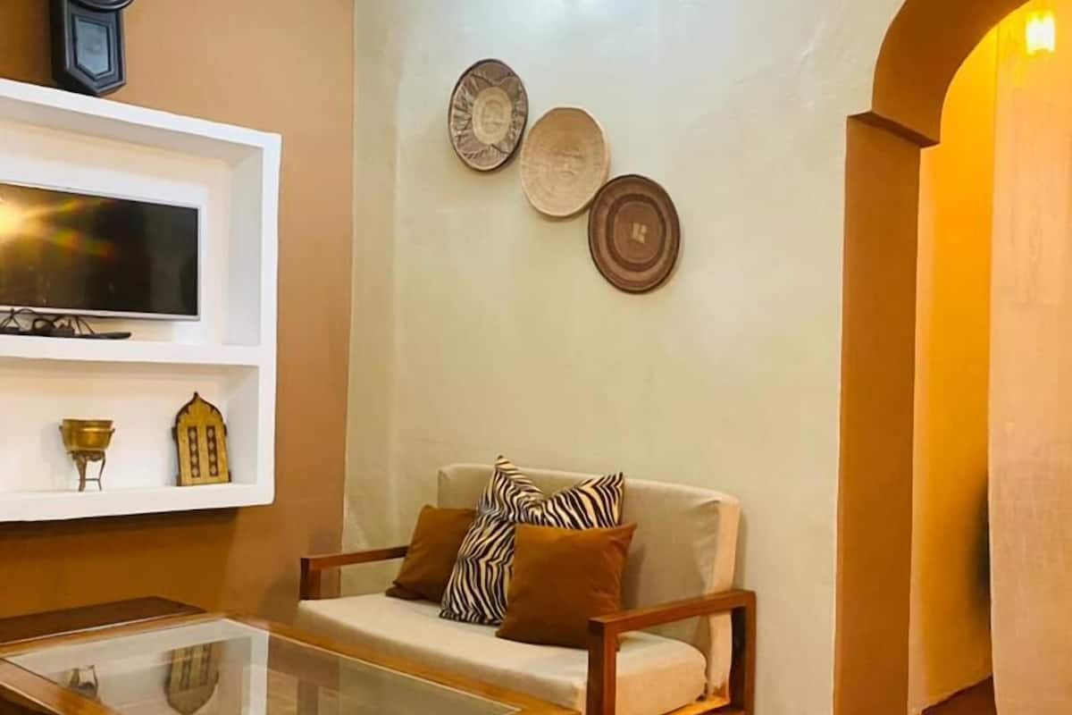 Casa Deluxe | Area soggiorno | TV a schermo piatto, giocattoli