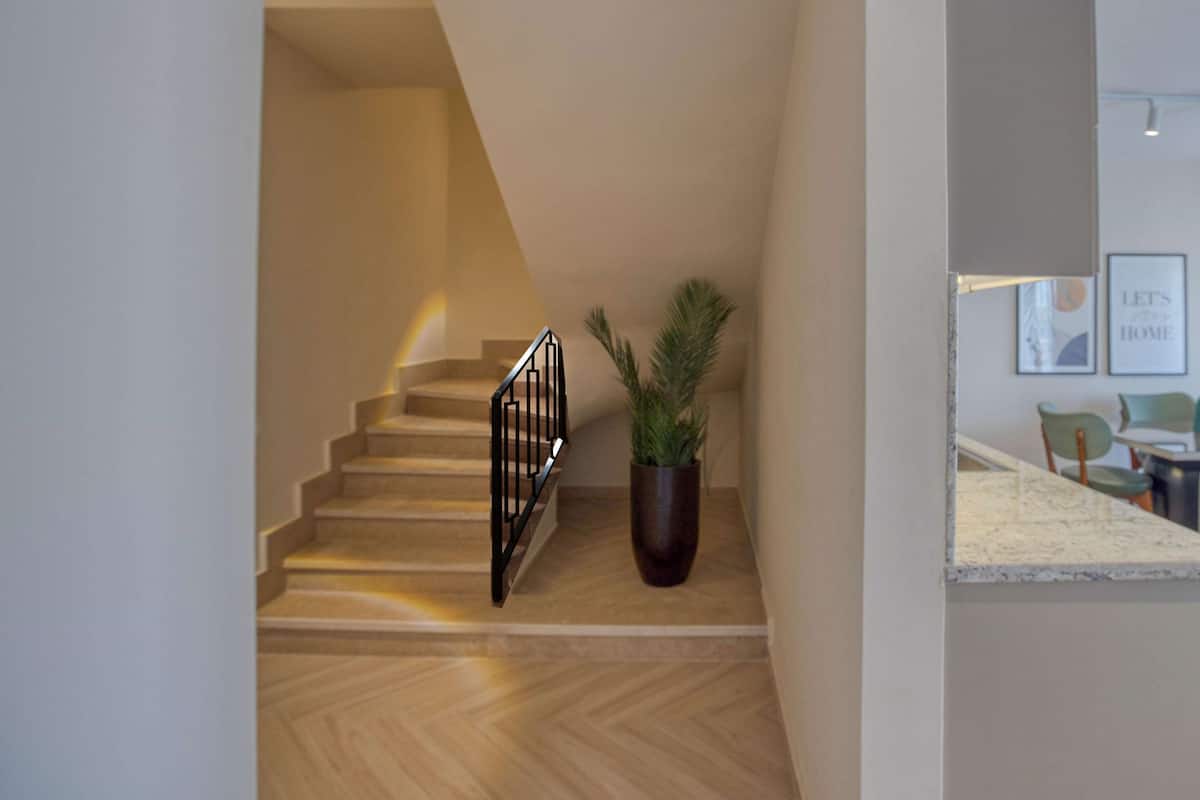 Family Duplex, 1 Bedroom | 1 bedroom, in-room safe, blackout drapes, iron/ironing board