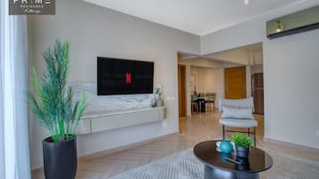 Standard Apartment, 1 Bedroom | Minibar, in-room safe, blackout drapes, iron/ironing board