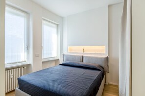 1 bedroom, desk, iron/ironing board, travel crib