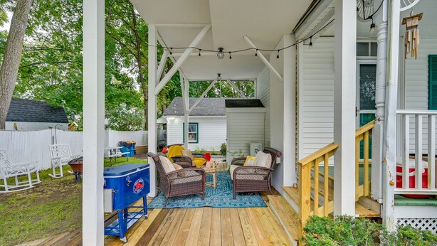 A covered porch with wicker furniture, a barbecue grill, and a wooden deck. - 5 Mi to Salem: Furnished Patio at Danvers Studio! (Danvers)