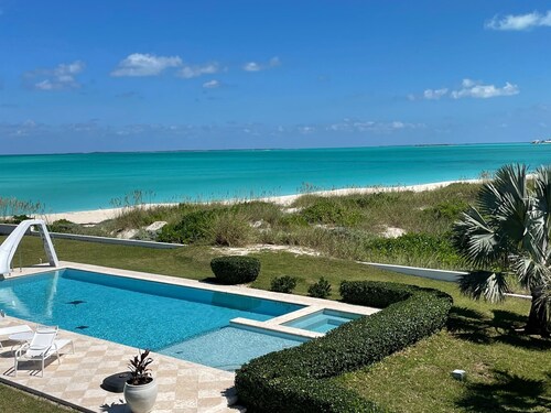 Family estate coach house and guest house on TC beach with beautiful pool