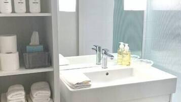Bathtub, hair dryer, towels
