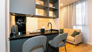 Junior Studio | Living area | 50-inch Smart TV with digital channels