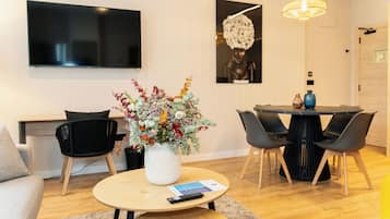 Family Apartment, 2 Bedrooms | Living area | 50-inch Smart TV with digital channels