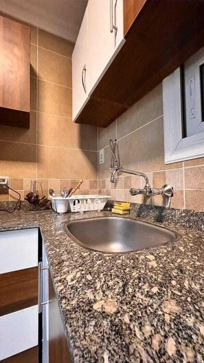 Apartment | Private kitchen | Fridge, stovetop, electric kettle, cookware/dishes/utensils