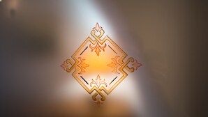 A geometric design with a central diamond shape and symmetrical patterns. - IL VICOLO (Ruvo di Puglia)