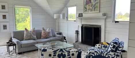 Lovely seating area upstairs, cozy with the fireplace.