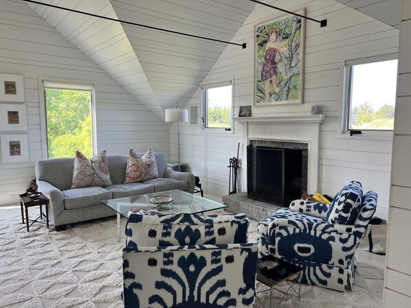 Lovely seating area upstairs, cozy with the fireplace.