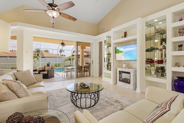 Smart TV, fireplace, books, computer monitors - Villa Haze – Private Pool, Hot Tub & Backyard Oasis near Fort Myers Beaches (Cape Coral)