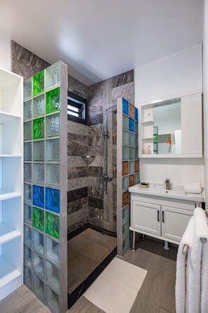 Shower, hair dryer, towels, soap