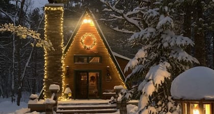 Cozy Cabin nestled in the woods on all season road seconds from the trail system