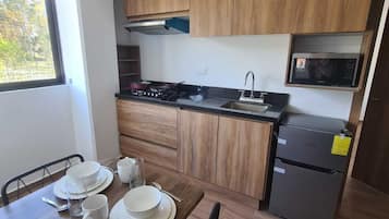 Suite | Private kitchen | Mini-fridge, microwave, coffee/tea maker, toaster