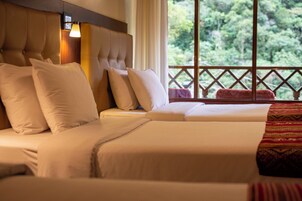 Deluxe Quadruple Room, Balcony, Mountain View | In-room safe, free WiFi, bed sheets