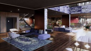 Un vestíbul ampli amb un disseny modern, que inclou una escala, zones d'estar i un bar.