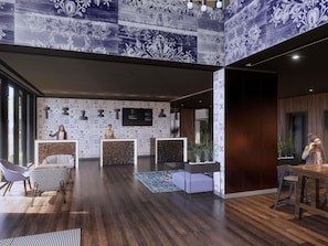 A modern reception area with patterned wallpaper, a reception desk, seating, and a wooden floor. - Mercure Sibiu Arsenal (Sibiu)