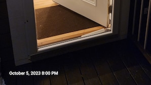 A partially open door with a view into a room. - Secluded in The Woods (Dana)