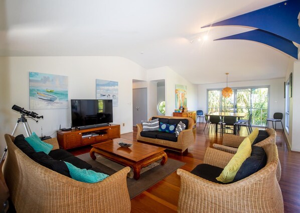 Living area - Surf Gums is a four bedroom, 2 bathroom home nestled in amongst native gum trees (Point Lookout)