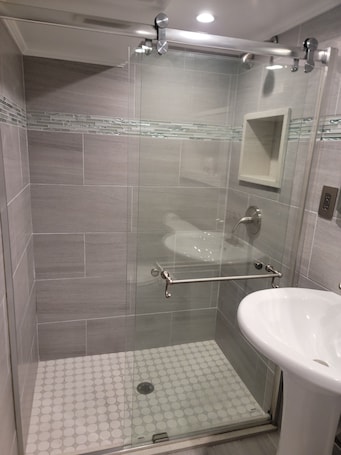 Shower, hair dryer, towels, soap. The Subterranean Haven