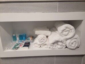 Shower, hair dryer, towels, soap
