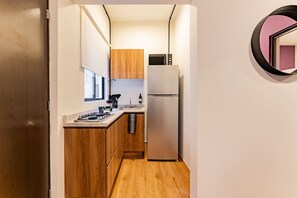 Fridge, microwave, stovetop, coffee/tea maker