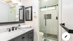 A bathroom with a large mirror, a sink with three faucets, a toilet, and a glass-enclosed shower. - MaGiQ Private Master En-Suite w Private Bathroom, No Shared Spaces (Spring Valley)