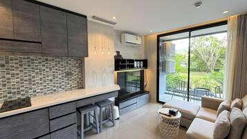 Comfort Apartment | Living area | 42-inch Smart TV with cable channels