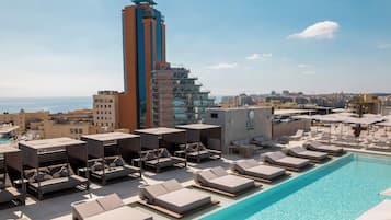 Seasonal outdoor pool, pool umbrellas, pool loungers
