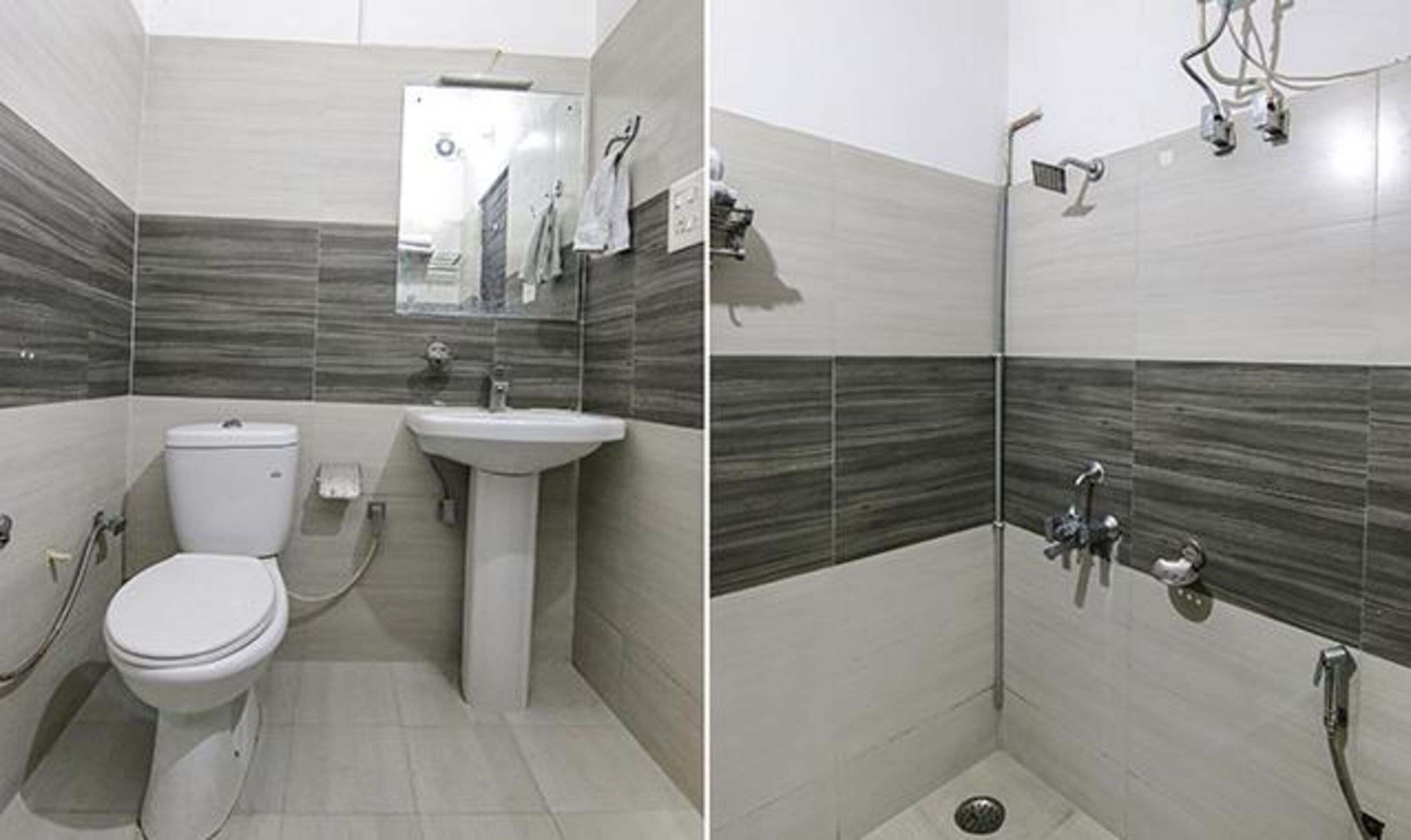 A bathroom with a toilet, sink, and shower.