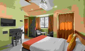 A hotel room with a bed, a desk, a chair, and a window with curtains. - Fabexpress The Trousseau (Pune)